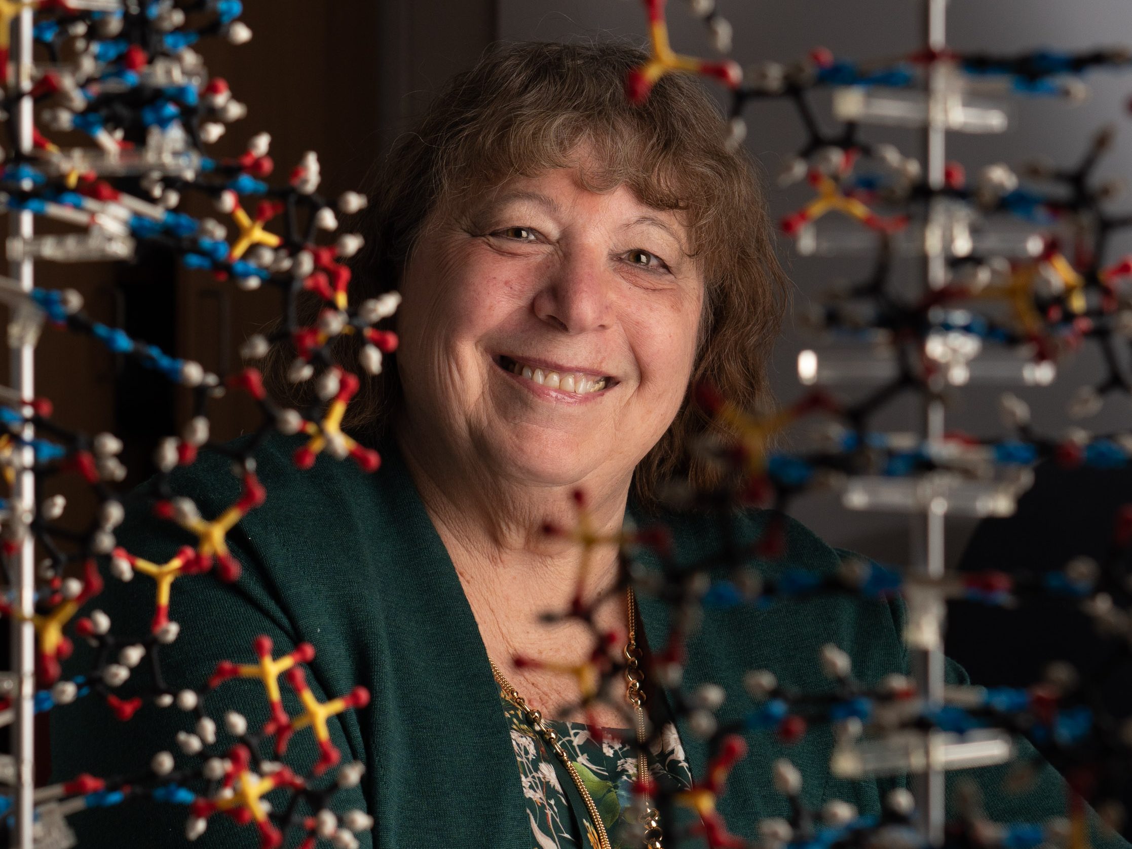 Virologist Ann Palmenberg with DNA model.